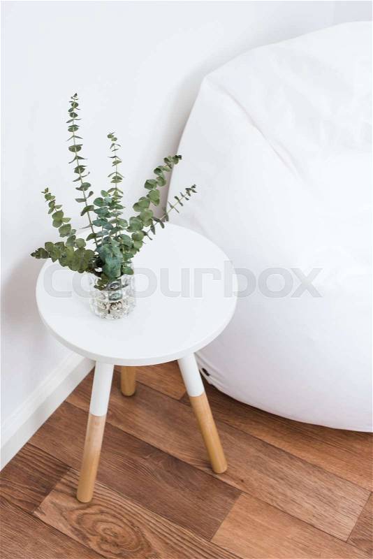Scandinavian home interior decoration, simple decor objects and bean bag chair, minimalist white room, stock photo