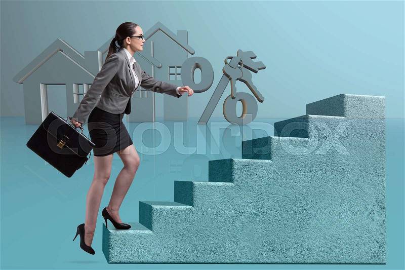 Businesswoman walking climbing stairs in mortgage, stock photo