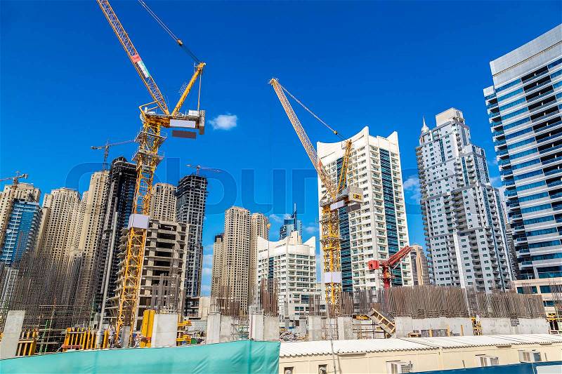 Construction worker in Dubai Marina in a summer day, United Arab Emirates, stock photo
