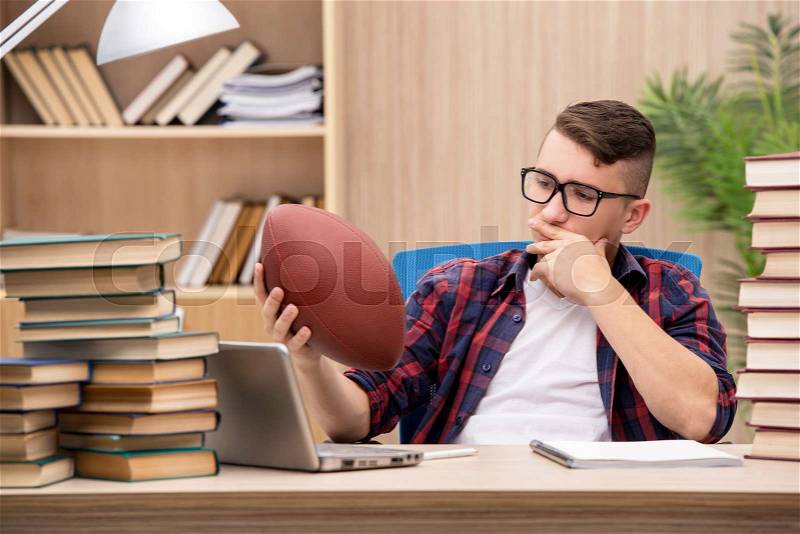 Young student preferring playing baseball to studying, stock photo