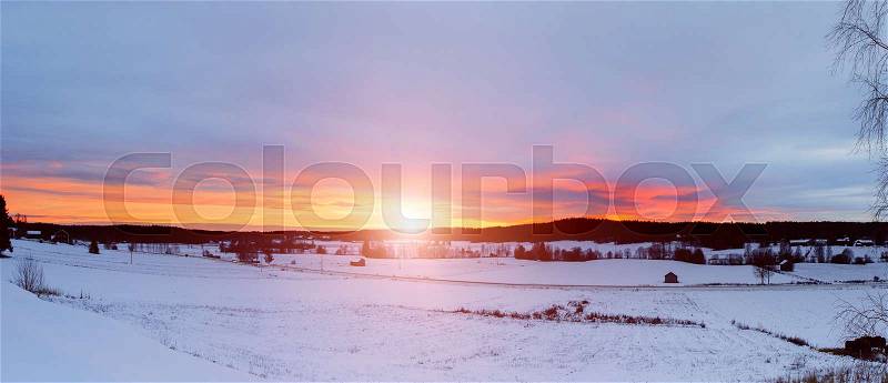 Winter sunset landscape with dramatic sky in Sweden, north scandinavian seasonal hipster background. Panoramic view, stock photo