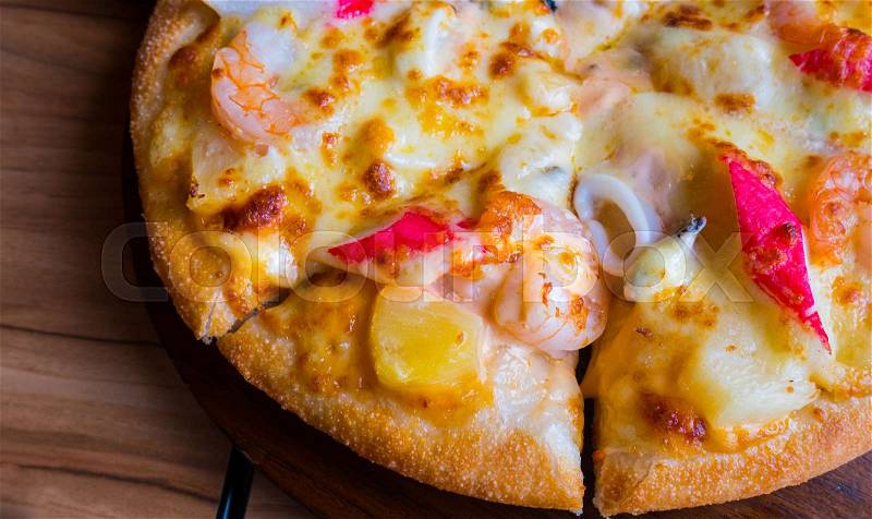 Close up of seafood pizza at italian restaurant, stock photo