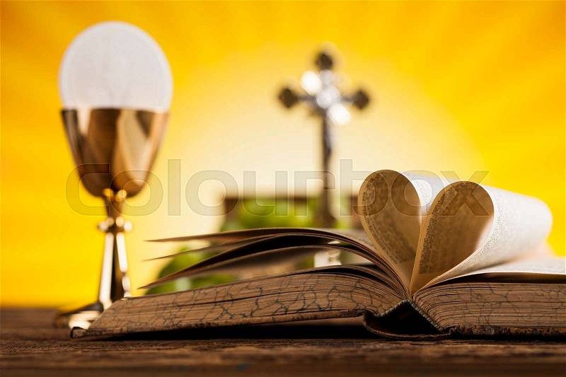 Symbol christianity religion a golden chalice with grapes and bread wafers, stock photo