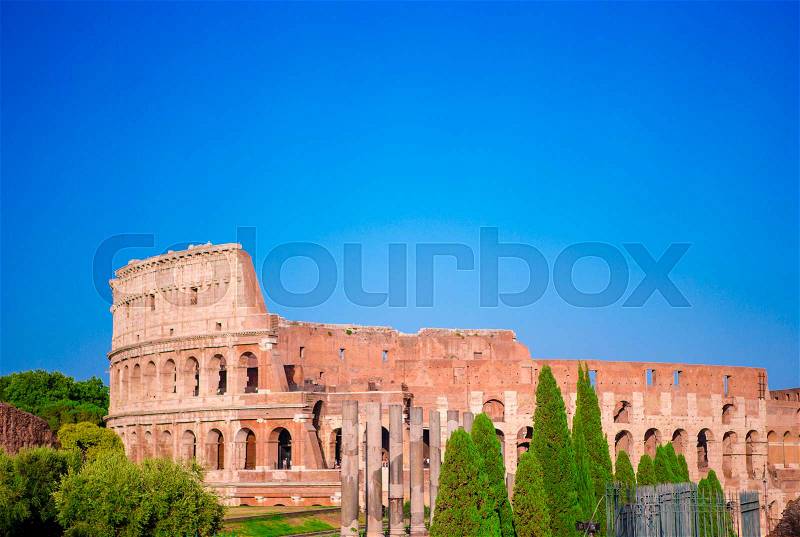 Colosseum or Coliseum background blue sky in Rome, Italy, stock photo