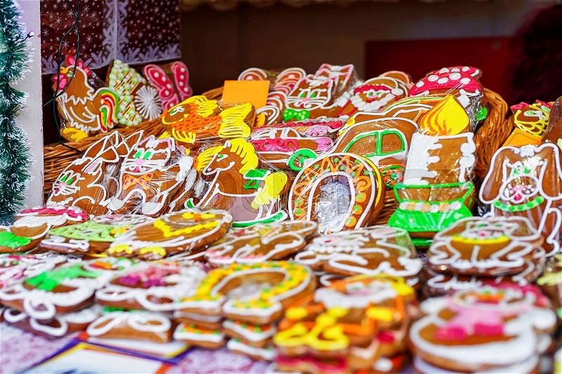 Colorful icing on the handmade gingerbreads displayed at the Christmas market in Riga, Latvia. Traditional sweets presented in various shapes, sizes and styles such as horse, cat and Santa, stock photo
