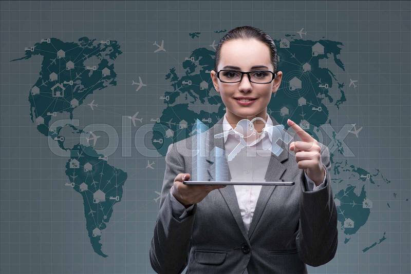 Businesswoman with tablet in hotel booking concept, stock photo