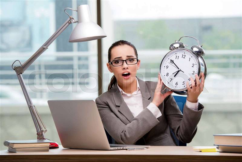 Businesswoman failing to meet challenging deadlines, stock photo