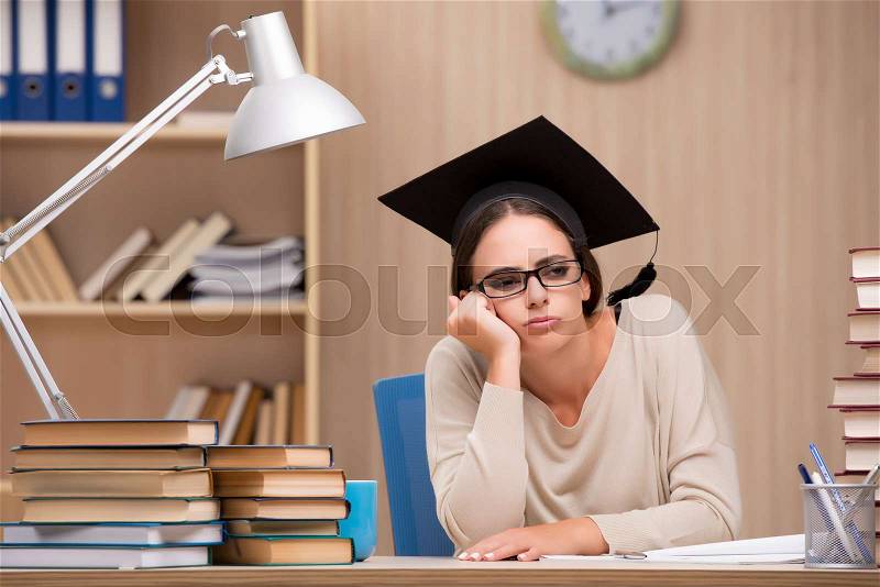 Young student preparing for university exams, stock photo