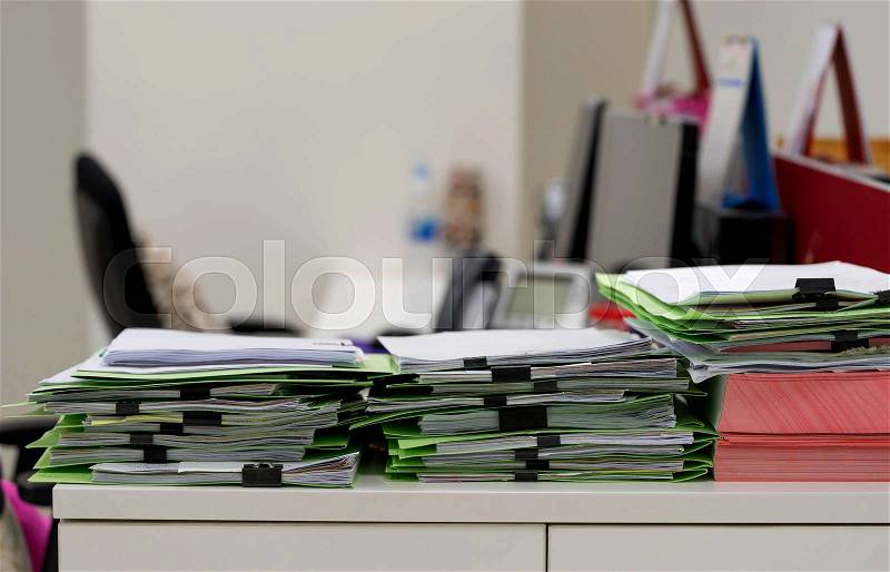 Many paper documents on table in office, stock photo