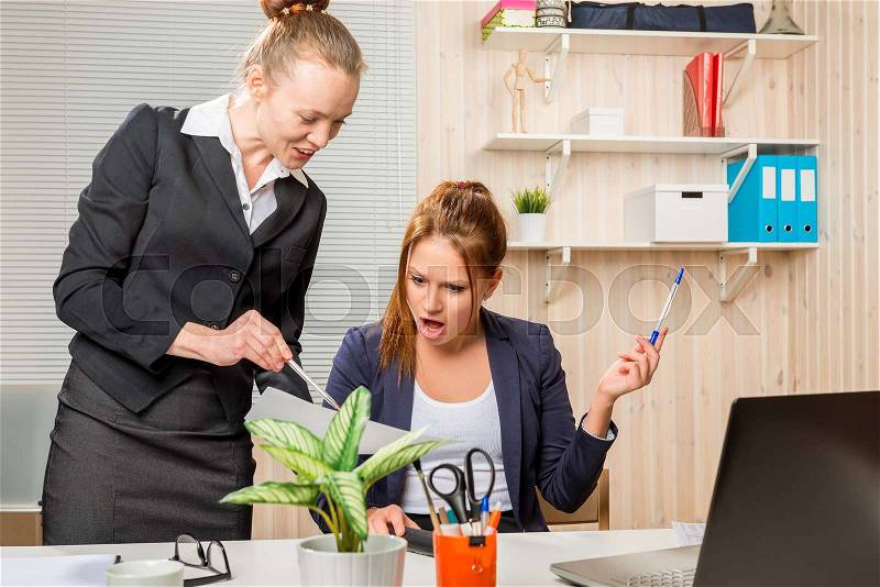 Director of accountant shows an error in the documents in the office portrait , stock photo