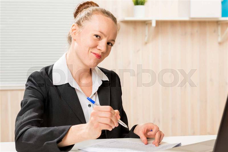 Leader woman posing signature on important documents, stock photo