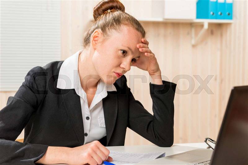 Disappointed woman looking for a Financial Analyst error reports, stock photo
