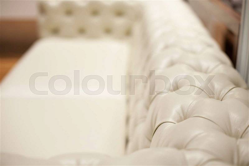 Ivory back of a luxury leather sofa, stock photo