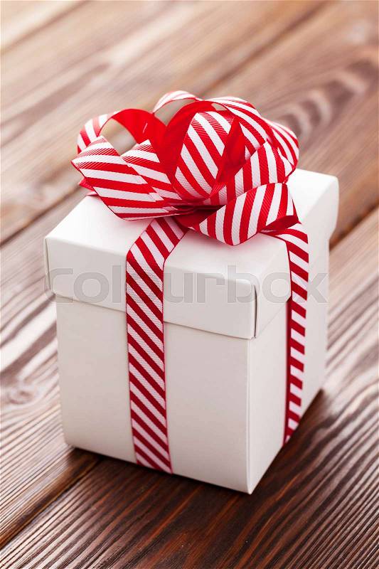 Christmas gift box on wooden table, stock photo
