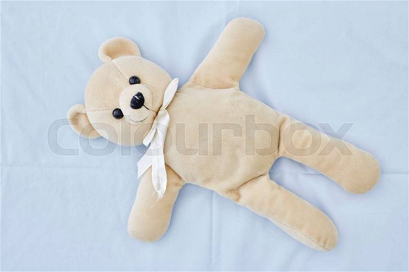 A studio photo of a toy bear, stock photo