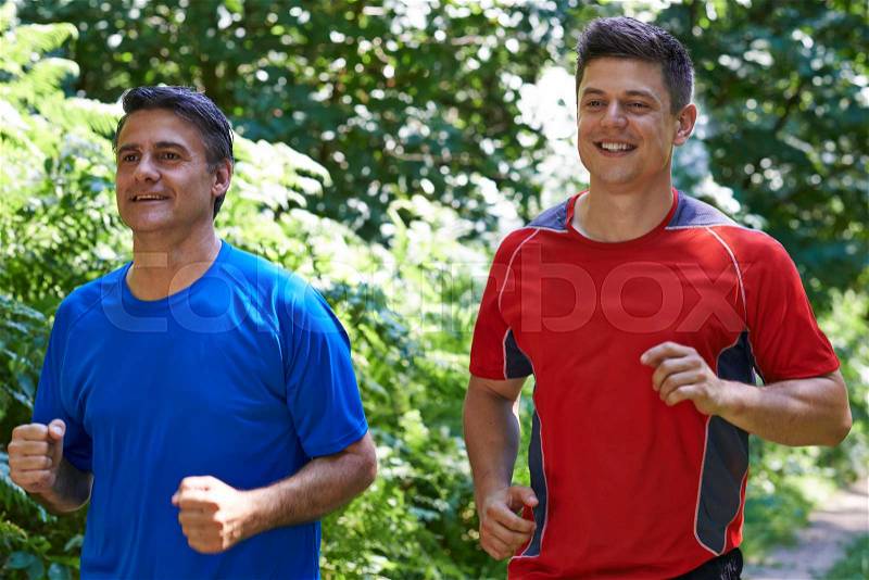 Two Men Running In Countryside Together, stock photo