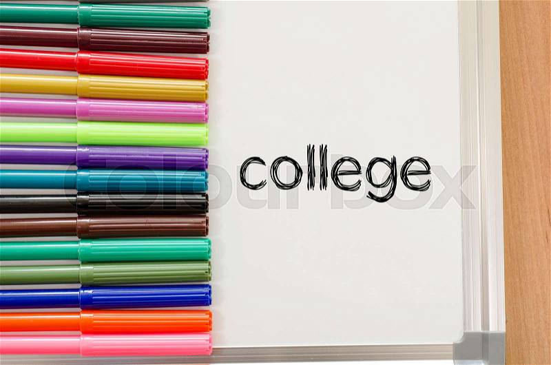 Felt-tip pen and whiteboard on a wooden background and college text concept, stock photo