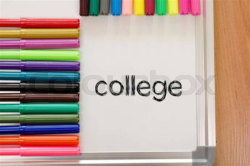 Felt-tip pen and whiteboard on a wooden background and college text concept, stock photo