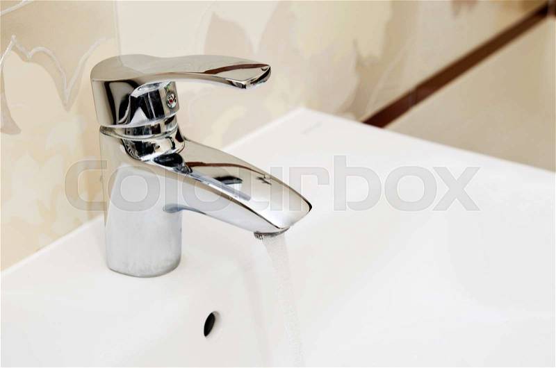 Faucet in clean bathtoom. Utilities water bill cost rise wash composition, stock photo