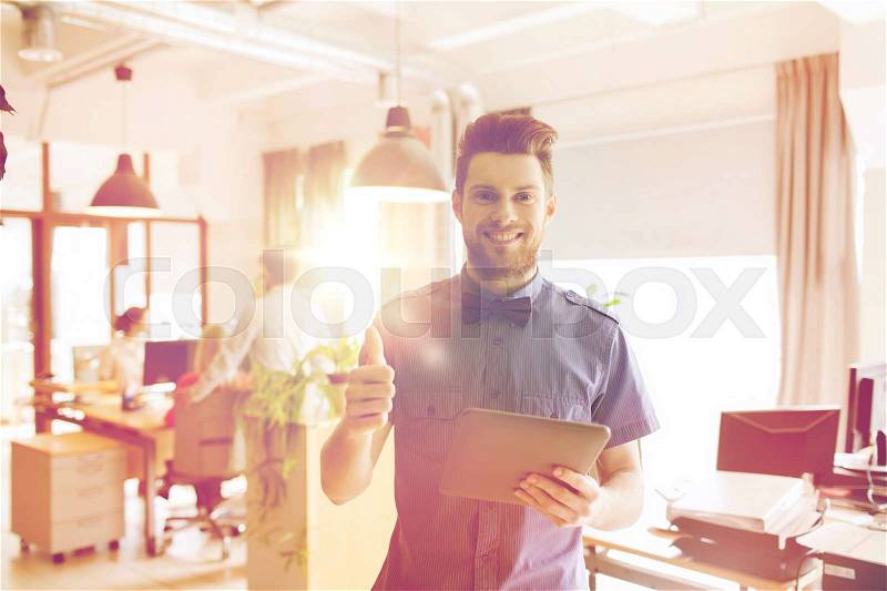 Business, startup and people concept - happy businessman or creative male office worker with tablet pc computer, stock photo