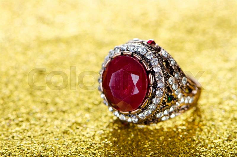 Jewellery concept with ring on shiny background, stock photo