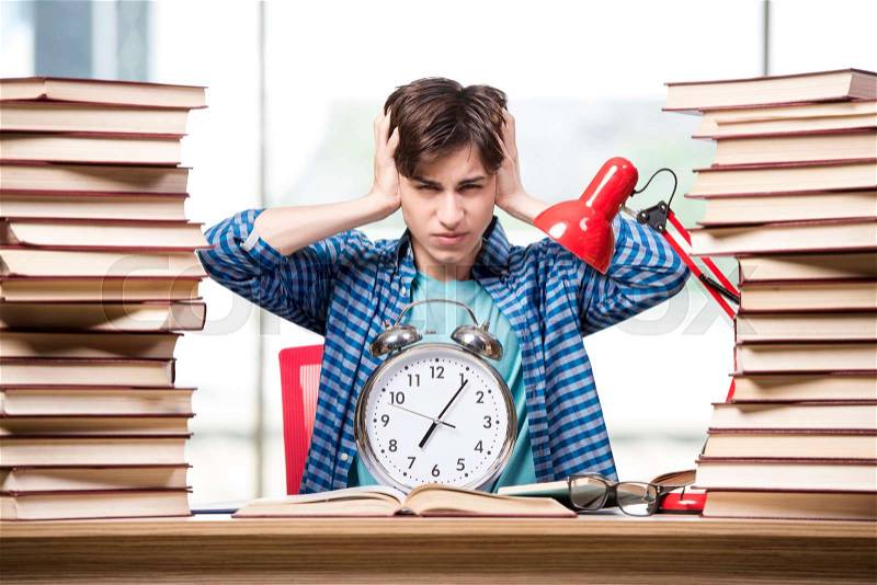 Young student preparing for school exams, stock photo
