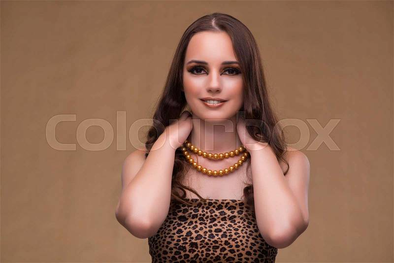 Young beautiful woman with pearl necklace, stock photo