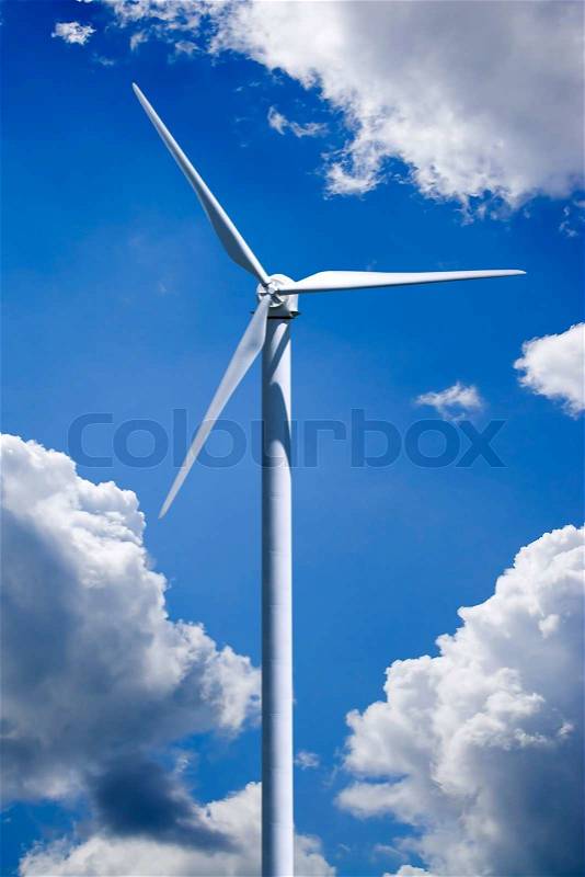 A single wind turbine over a cloud filled blue sky. Clipping path is included for easy isolation of the turbine, stock photo