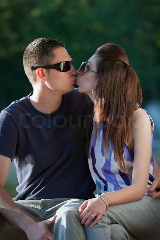 A young happy couple making out kissing, stock photo