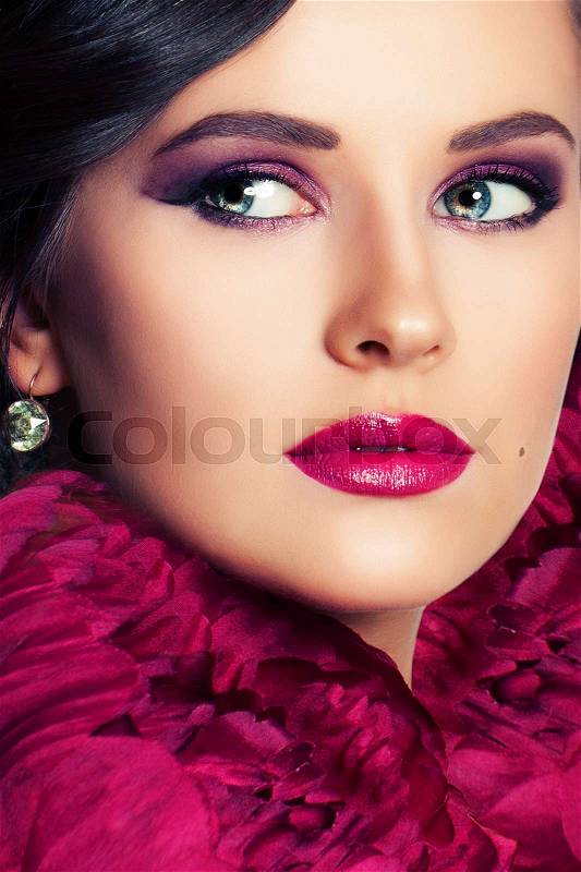 Beautiful Woman with Makeup and Flowers. Face Closeup, stock photo