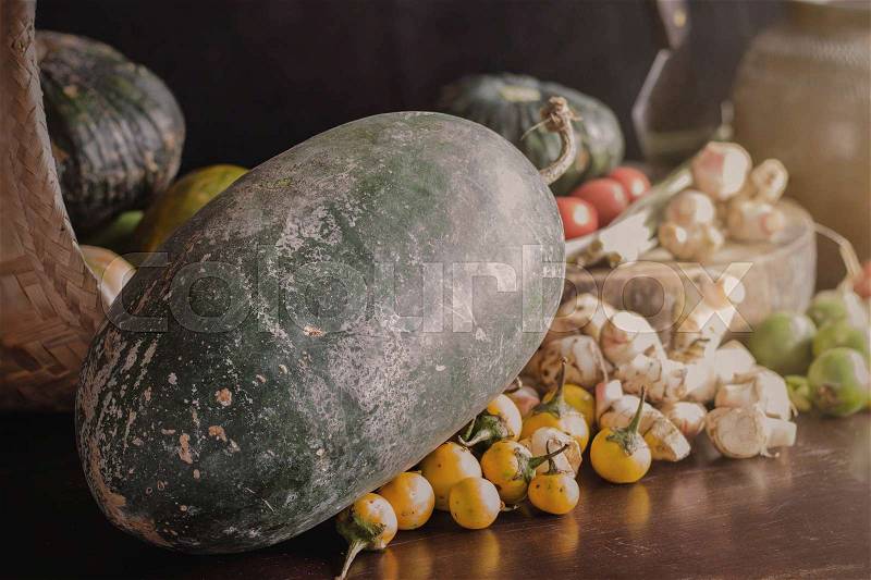 Marrow squash and spices for cooking on a wood table, stock photo