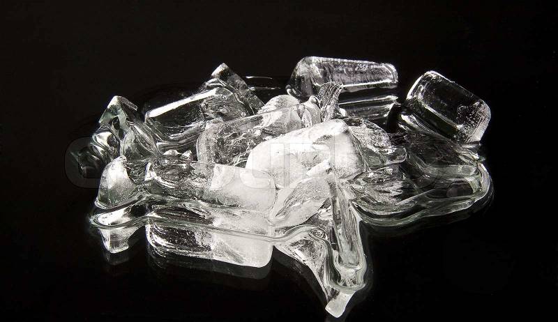 Cubes of ice on a black background, stock photo