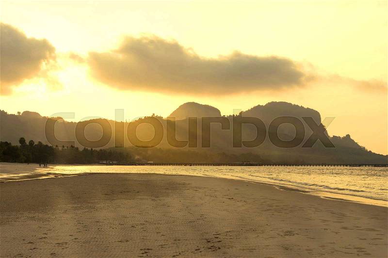 Sunrise and god ray on the beach , sunset time, stock photo