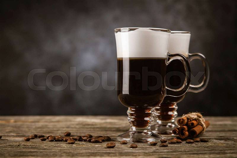 Hot Irish coffee with whiskey and cream, stock photo