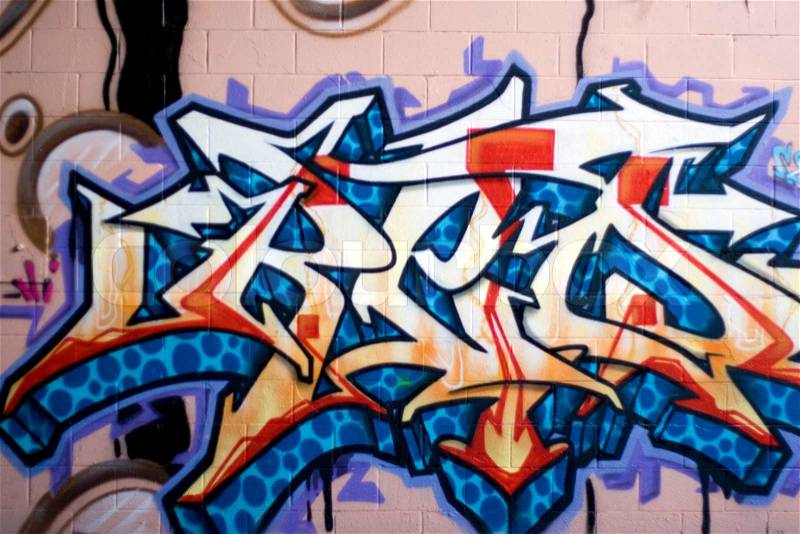 Colorful graffiti spray painted on a brick wall - makes a great background or backdrop, stock photo