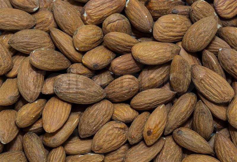 Background almond nuts close-up shot, stock photo