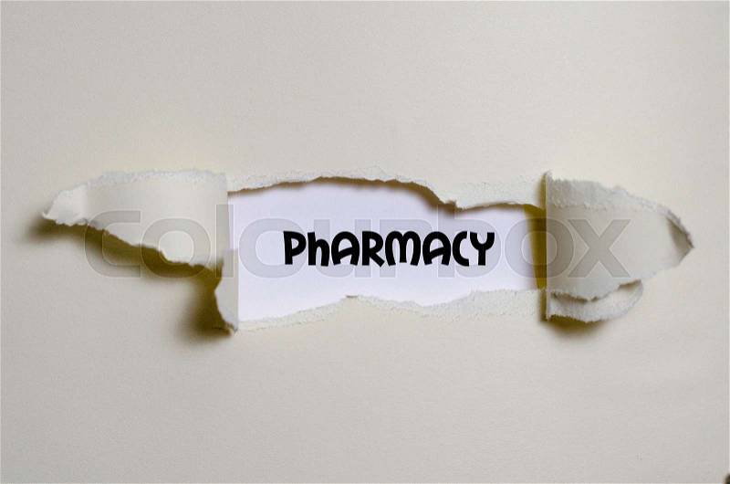 The word pharmacy appearing behind torn paper, stock photo