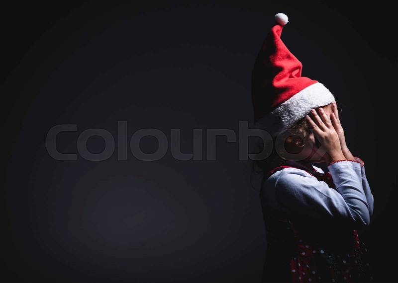 Little Santa wait for surprises,blank space and low key technique , stock photo