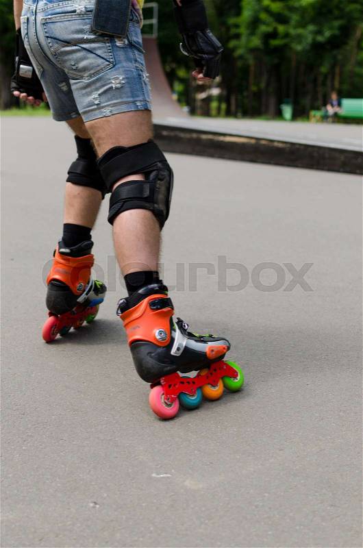Young man with on the roller skates, stock photo