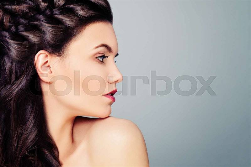 Young Woman Fashion Model. Female Profile on Blue Background, stock photo