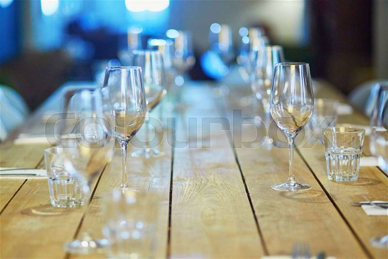 Row of wine glasses on the table in restaurant, bar or et wedding reception, stock photo