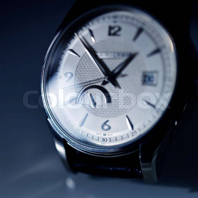 Extreme macro detail of swiss made watch shot with macro lens luxury male accessory for business, stock photo