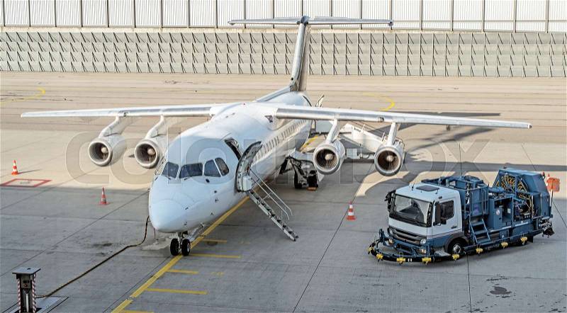 Commercial passenger plane in the airport. Aircraft maintenance, stock photo