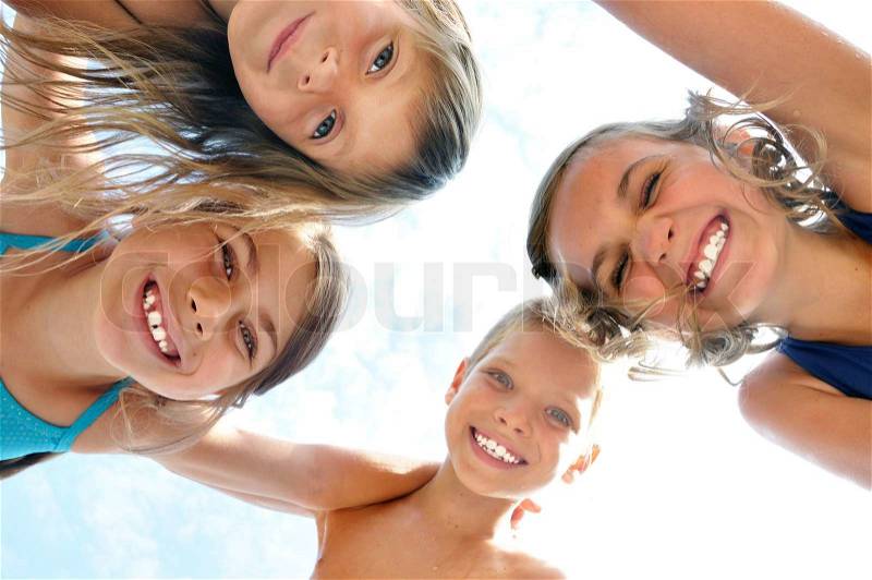 Happy smiling children frinds outdoor group portrait, stock photo