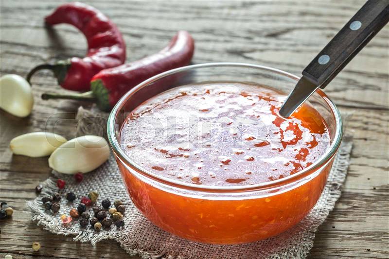 Glass bowl of thai sweet chili sauce, stock photo