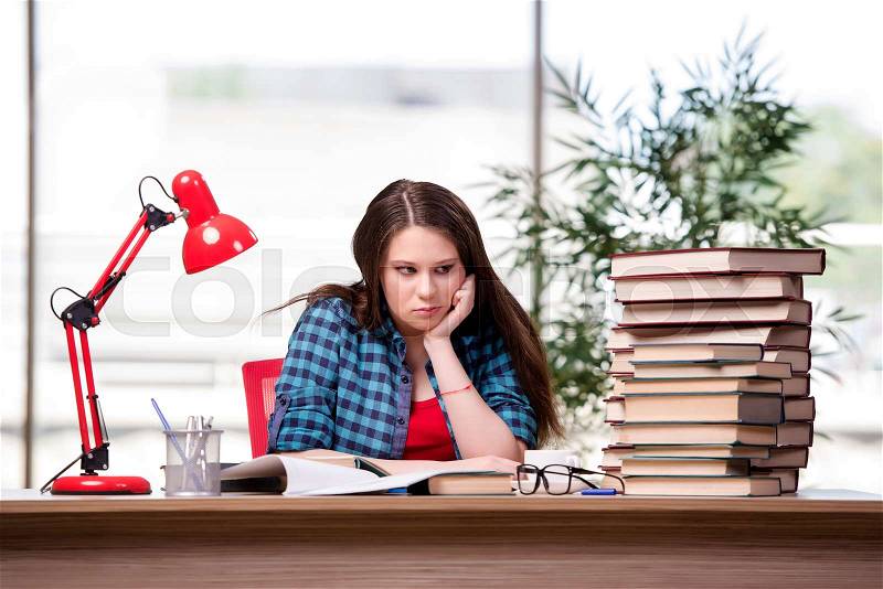 The young student preparing for school exams, stock photo