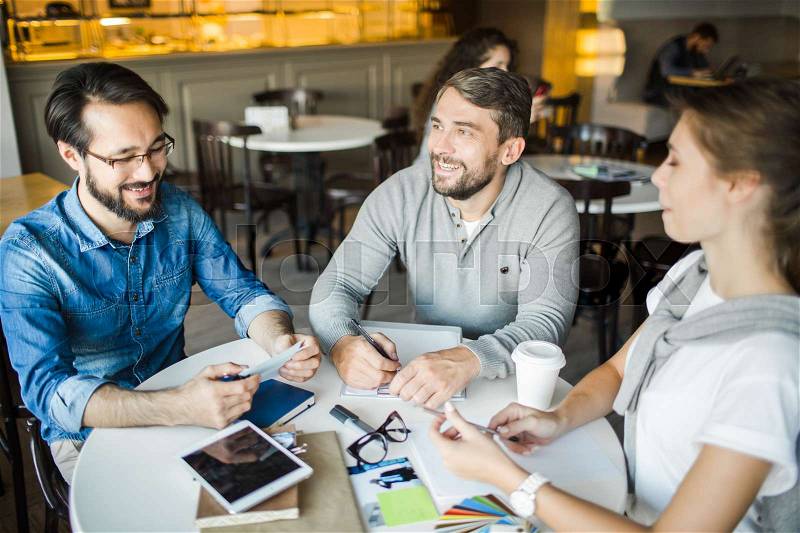 Contemporary designers planning new project in cafe, stock photo