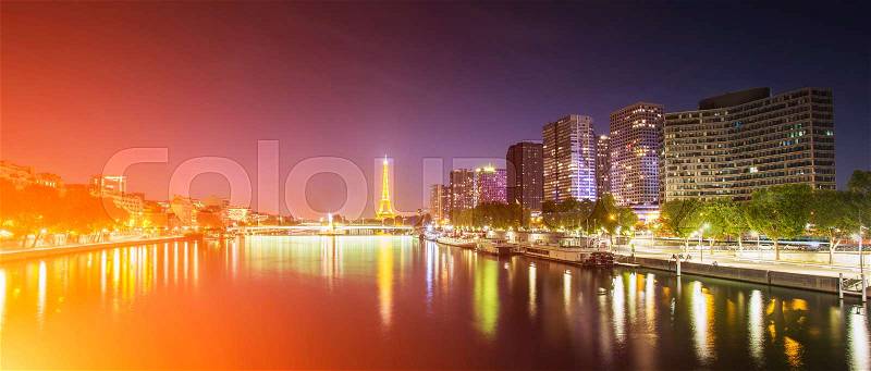 View of a Paris cityscape with tour eiffel and business district view from docks, Paris , stock photo