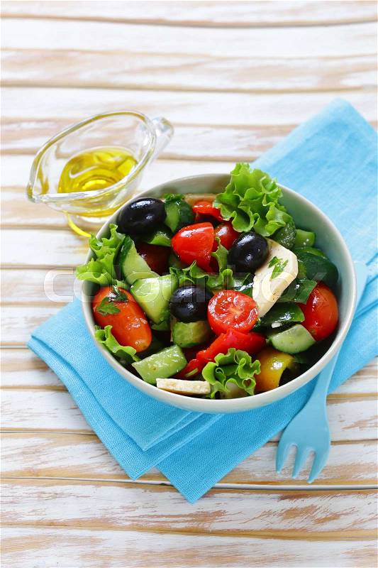 Mediterranean salad with olives, cheese and vegetables. Healthy food, stock photo