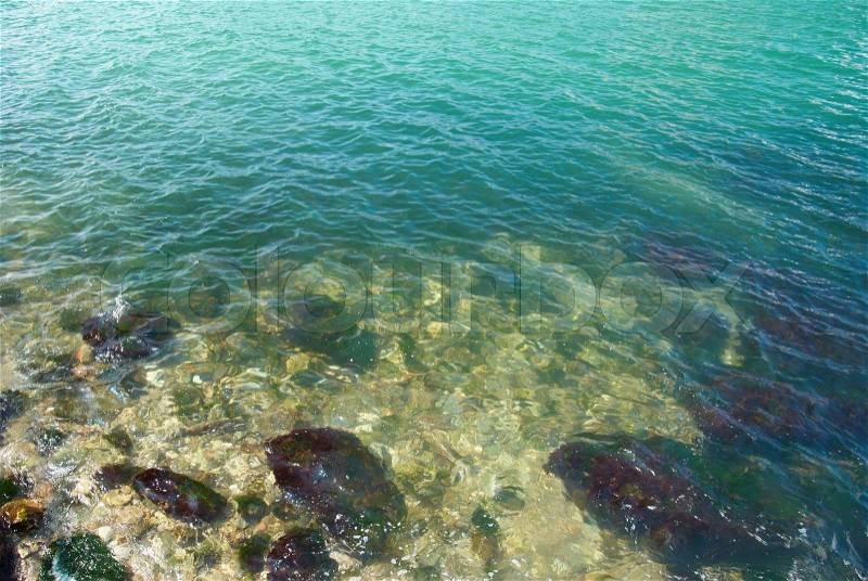 Blue tropical water with a sunlight reflections, stock photo